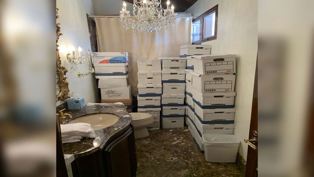 Boxes of classified documents are stored inside a bathroom and shower inside the Mar-a-Lago Club’s Lake Room in this photo included in Donald Trump’s federal indictment.