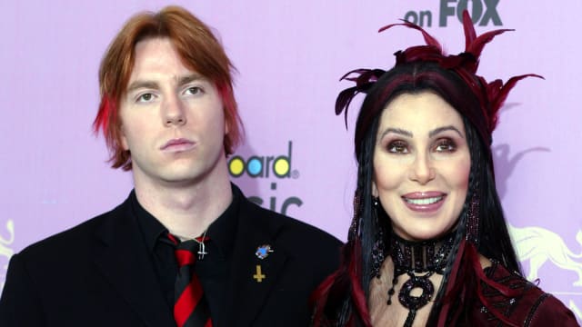 Cher poses with her son, Elijah Blue, at the MGM Grand Garden Arena in Las Vegas, Nevada December 9, 2002