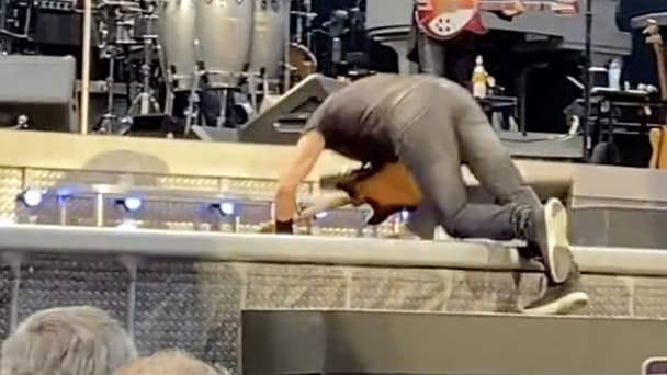 Bruce Springsteen falls on stage. 