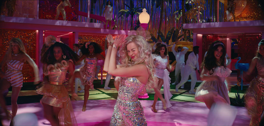 Margot Robbie dances during a scene in the Warner Bros. Barbie movie.
