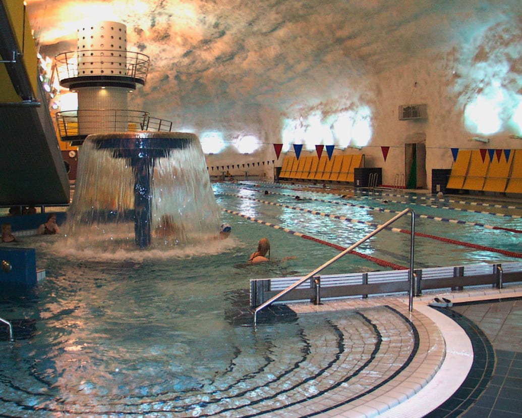 A photograph of the interior of the Itäkeskus swimming hall in Helsinki, Finland.