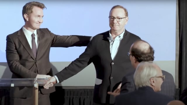 Kevin Spacey shakes hands with Douglas Murray as he receives a standing ovation in Oxford. 