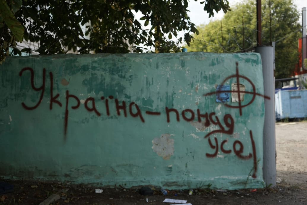 Graffiti on a wall that says Ukraine Above All in ﻿Sudzha, Russia.