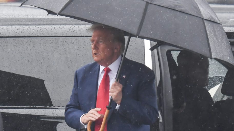 Former US President and 2024 hopeful Donald Trump arrives to Ronald Reagan Washington National Airport in Arlington, Virginia, on August 3, 2023, after his arraignment in court.