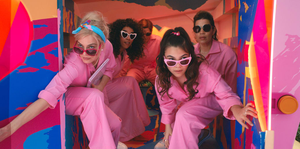 A photo still of Margot Robbie, Alexandra Shipp, Michael Cera, Ariana Greenblatt and America Ferrera in the movie Barbie.